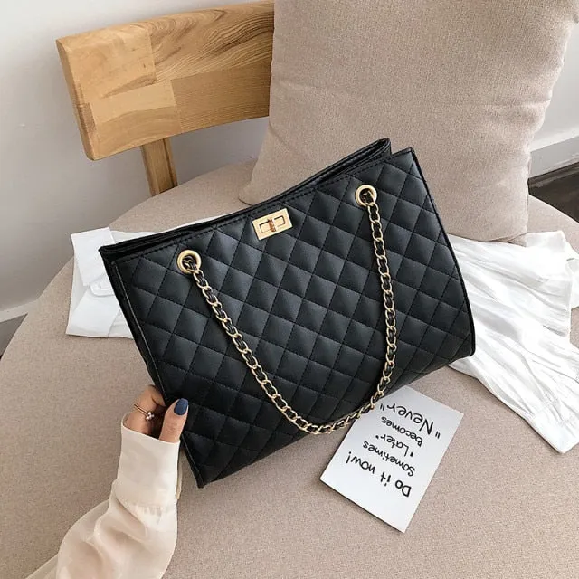 Black rectangular padded Handbag
