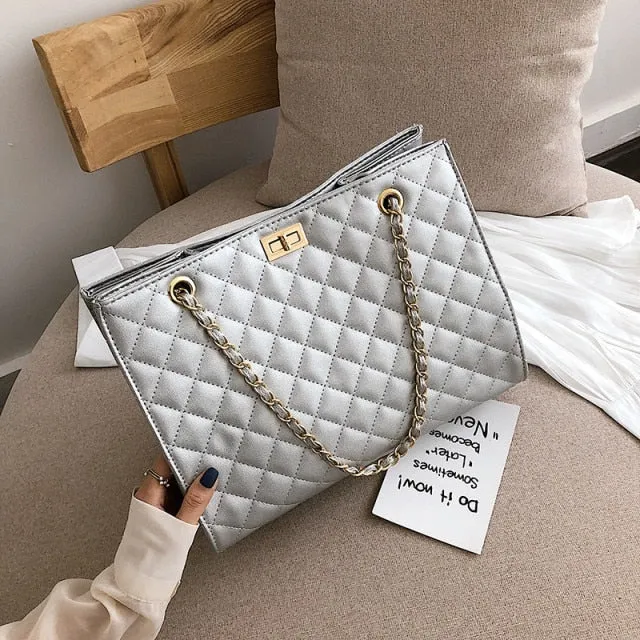 Black rectangular padded Handbag